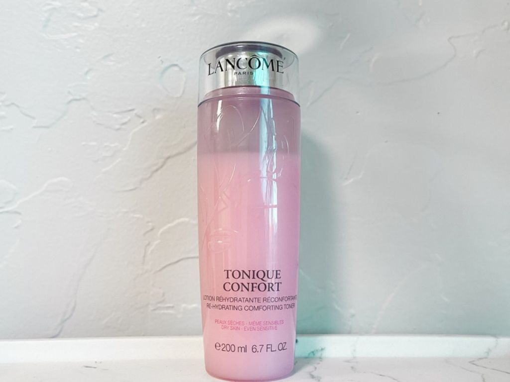 bottle of Lancome Tonique Confort Hydrating Toner w/ Hyaluronic Acid on marble surface