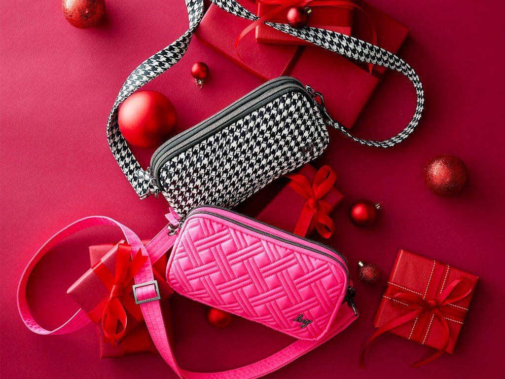 pink and houndstooth print crossbody bags surrounded by red christmas ornaments and gift boxes