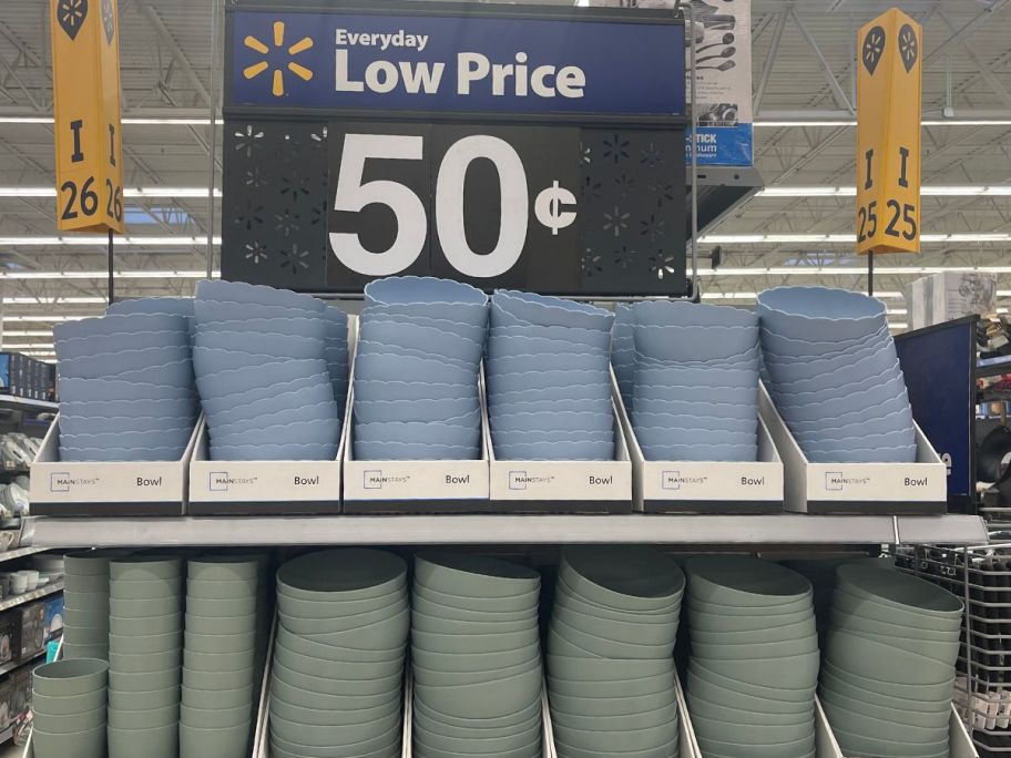 blue plastic cereal bowls on store shelf and green plastic tumblers and cereal bowls on shelf