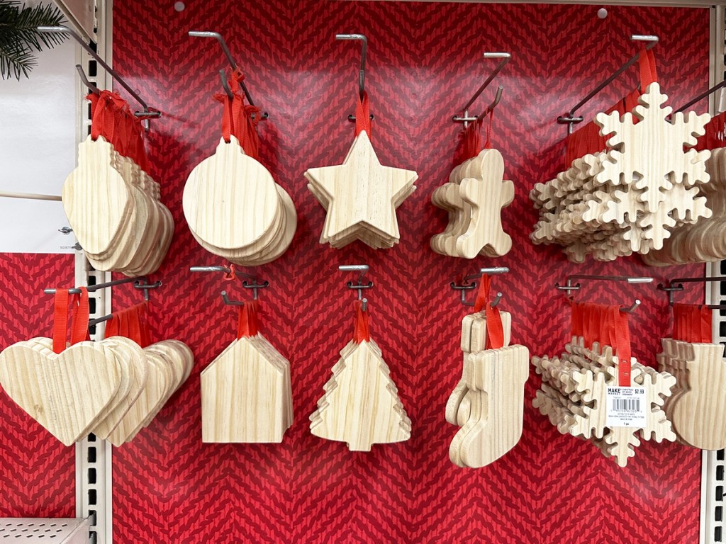 wood diy ornaments on display wall at store