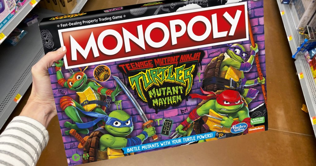hand holding box for Teenage Mutant Ninja Turtles Monopoly game