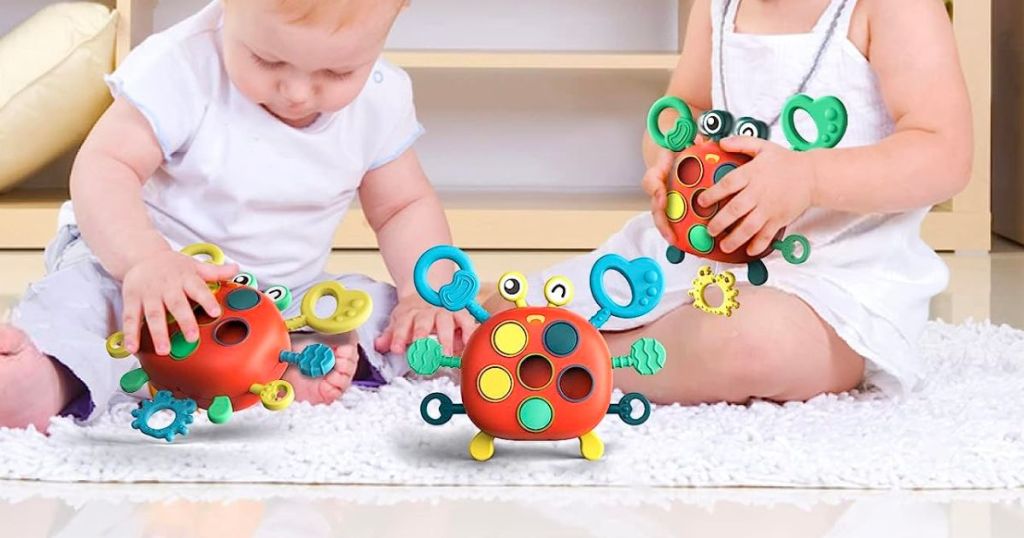 two toddlers plating with Montessori Sensory Toys for Toddlers