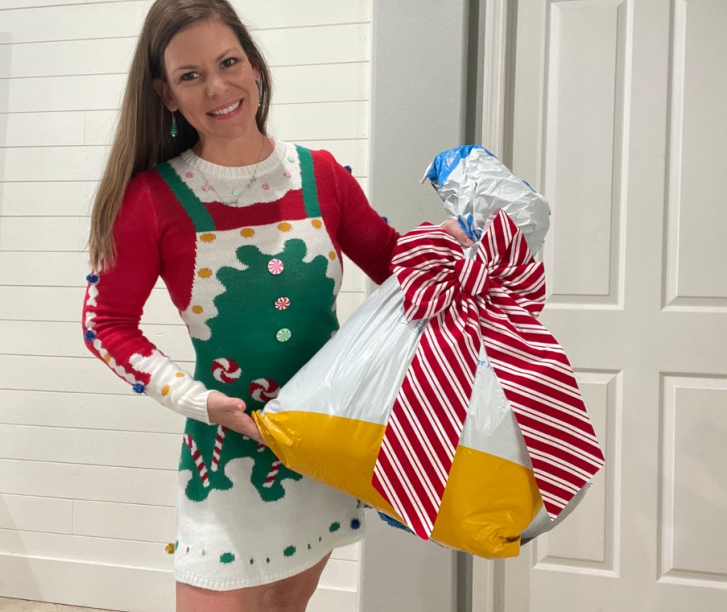 Woman holding christmas toys from walmart