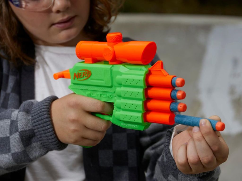 A child playing with a nerf gun