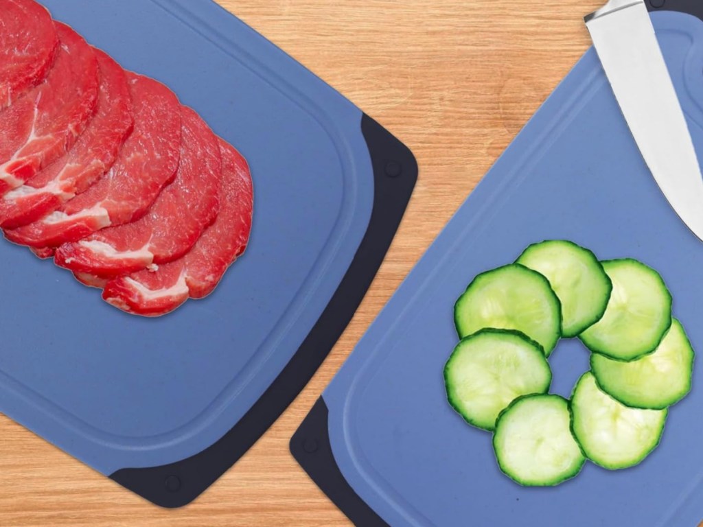 Navy cutting boards with meat slices, and cucumber slices