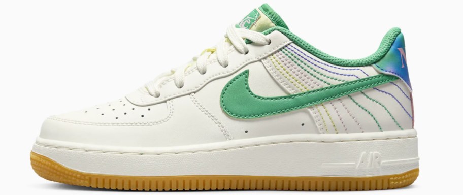 white and green nike sneaker with yellow, green, and blue stitching at the back