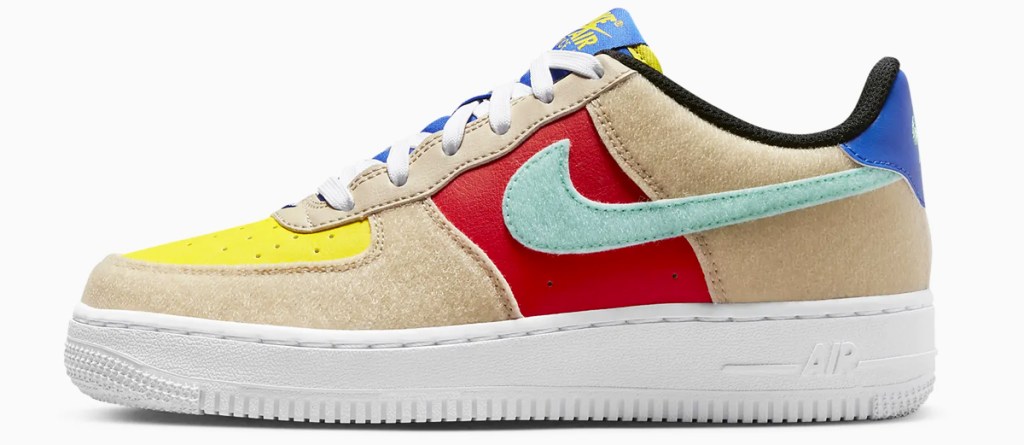 suede brown, yellow, red, and blue nike sneaker