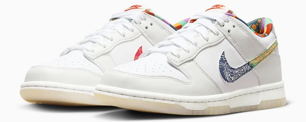 pair of white sneakers with multi color nike logo and interior