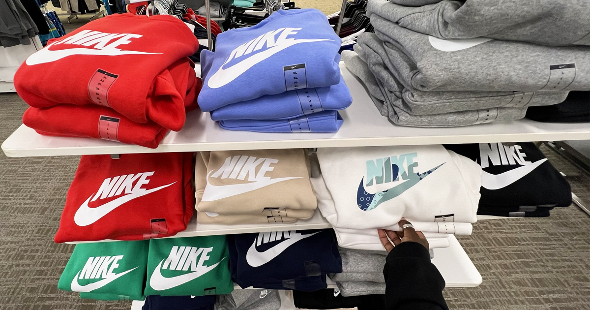store display shelves full of nike hoodies in various colors