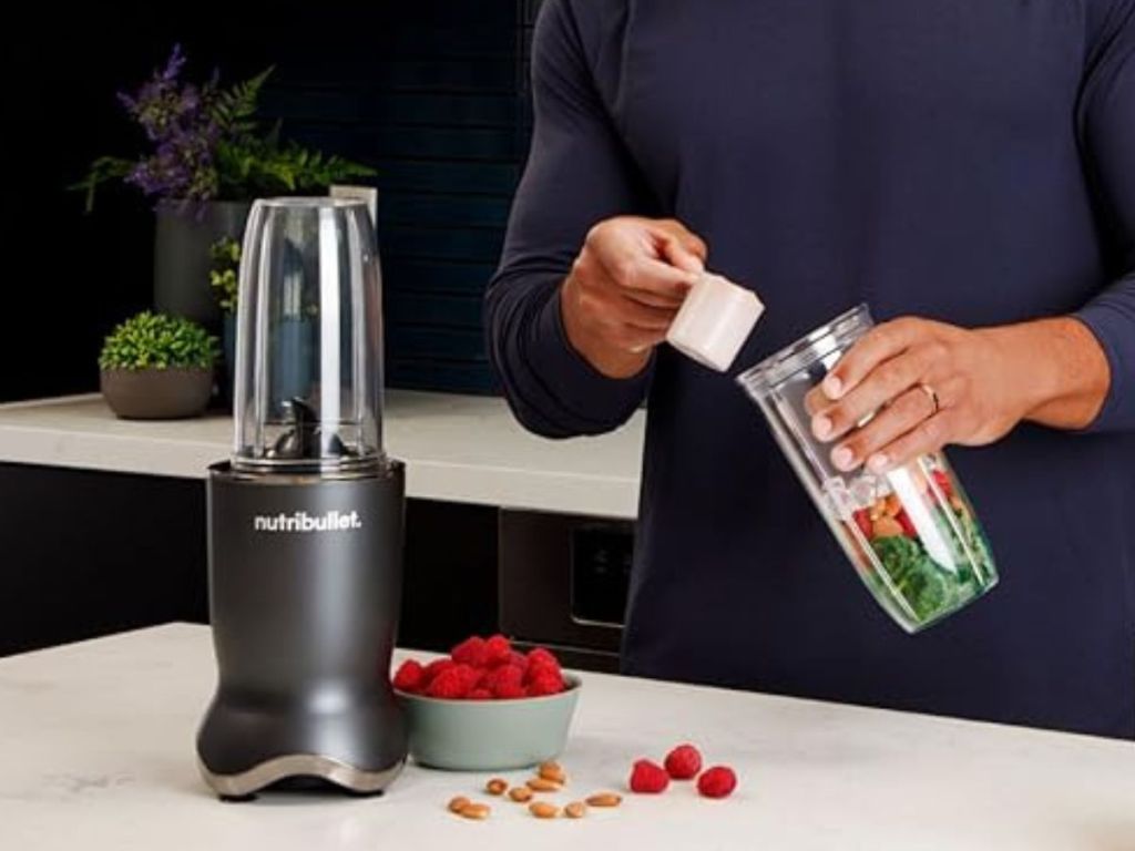 man making a protein smoothie with a nutribullet ultra