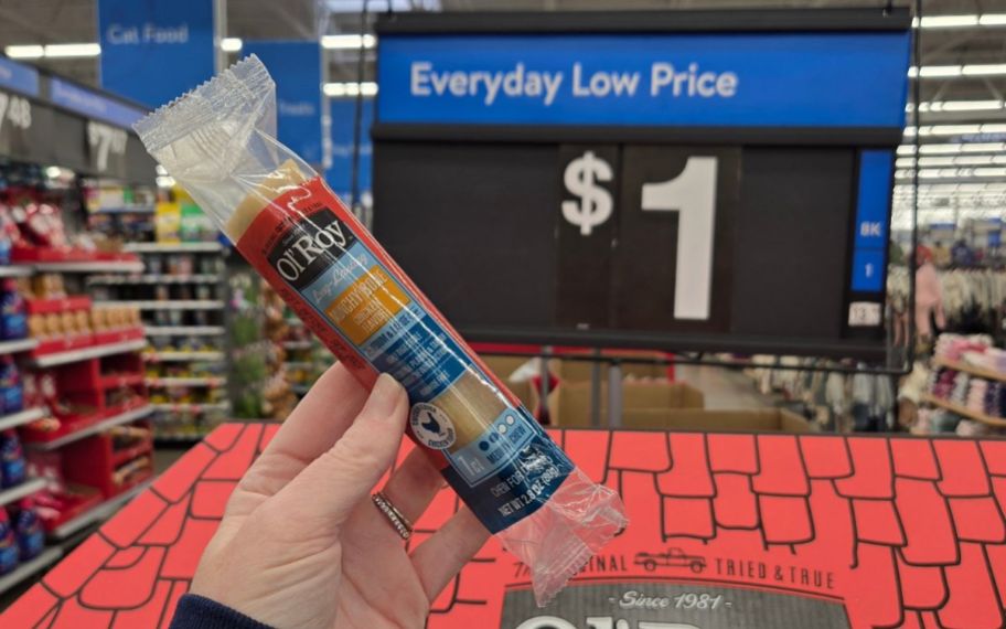 hand holding Ol' Roy Munchy Bone Chew Treats Chicken Flavor