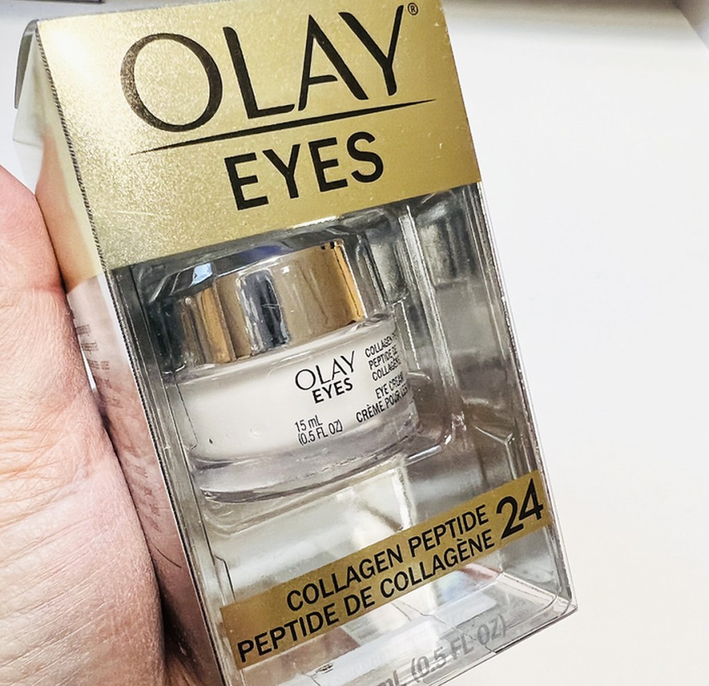hand holding package of Olay Collagen Peptide 24 Eye Cream