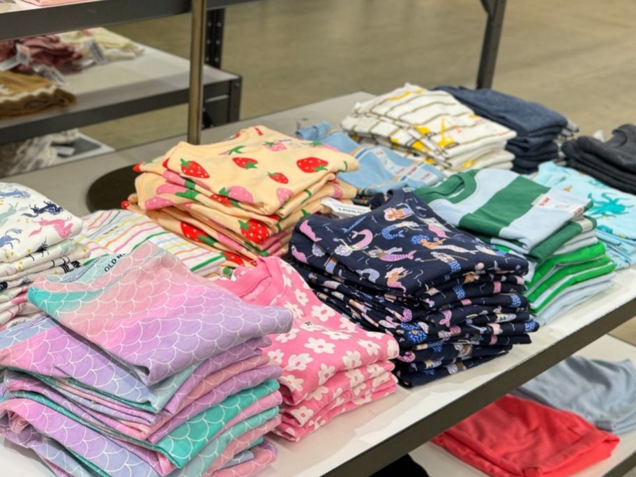 Table of folded kids tees at Old Navy