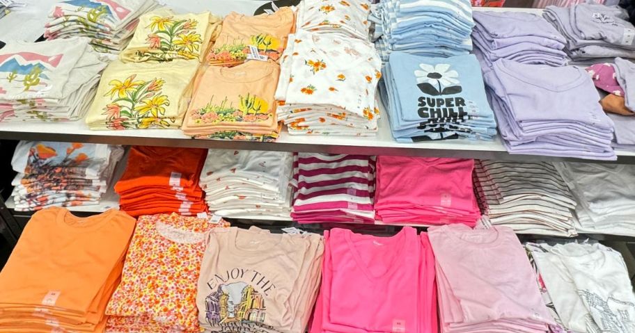 A table of folded Women's Tees at Old Navy