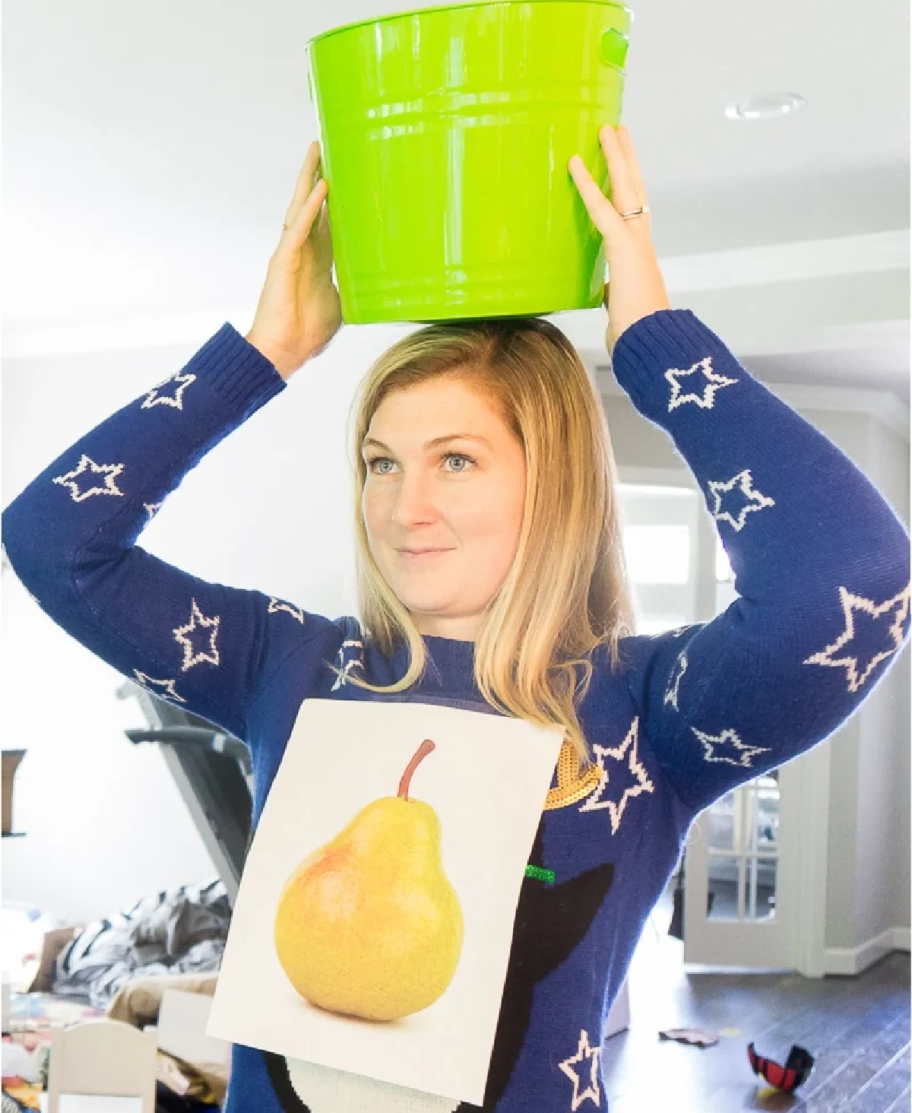 Woman playing "A Patridge In a Pear Tree" which is a minute to win it christmas game