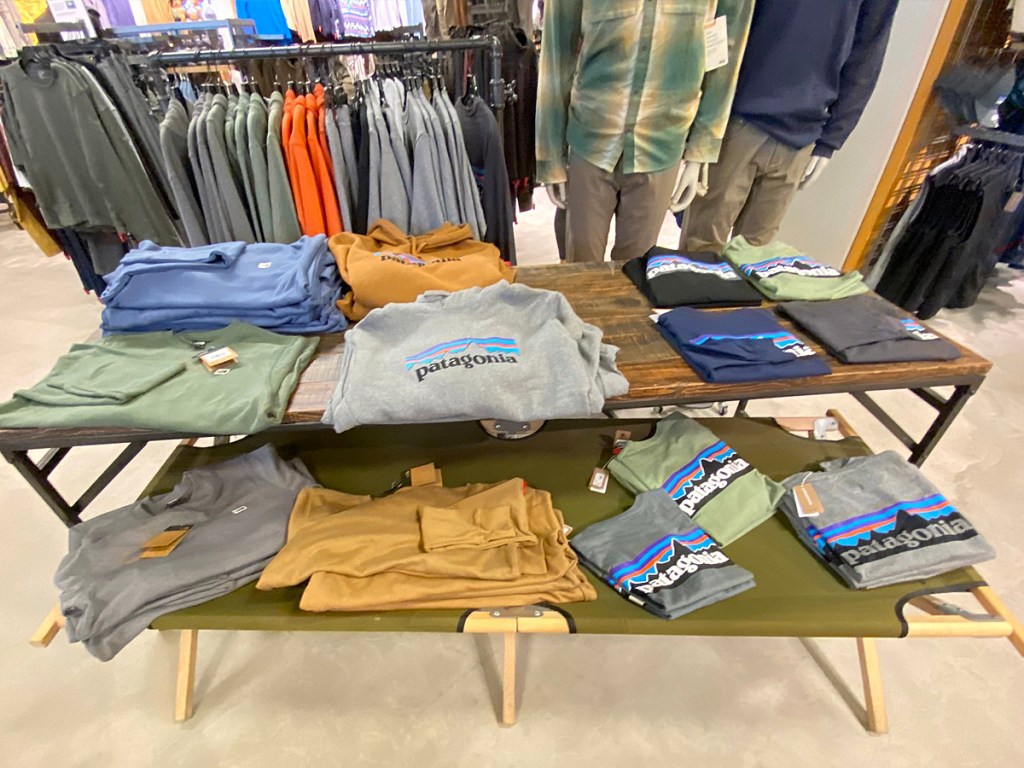 display table of men's patagonia shirts at rei