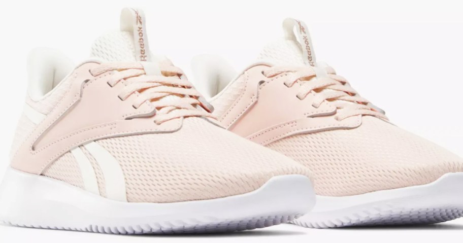 pair of light pink reebok sneakers