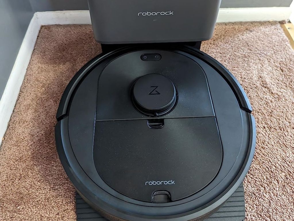 roborock robot vacuum on charger on carpet
