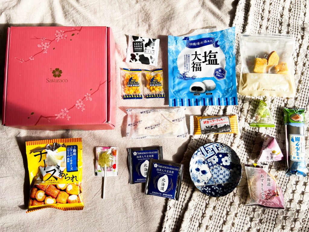 Japanese snacks and teas laid out on balnket