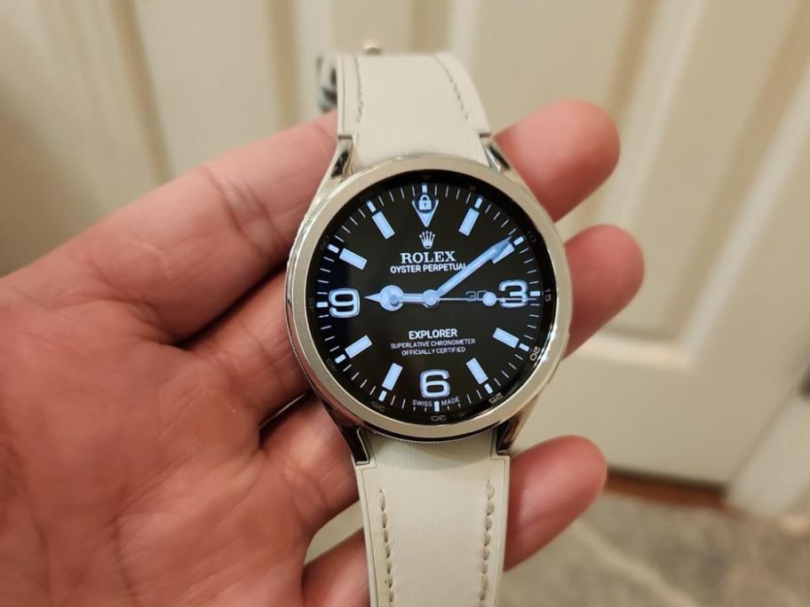 A person holding a Samsung Galaxy Watch6