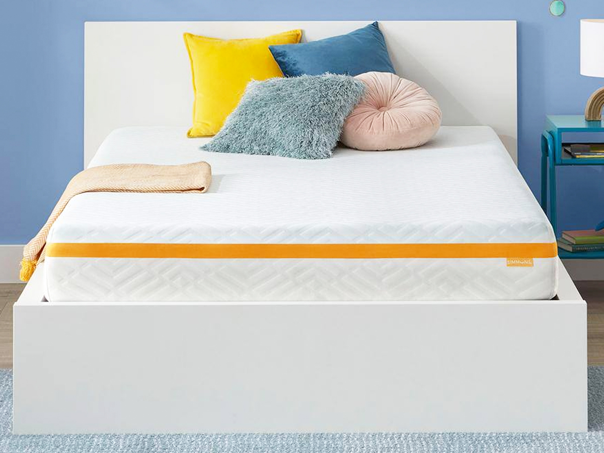 memory foam mattress on a white bed frame