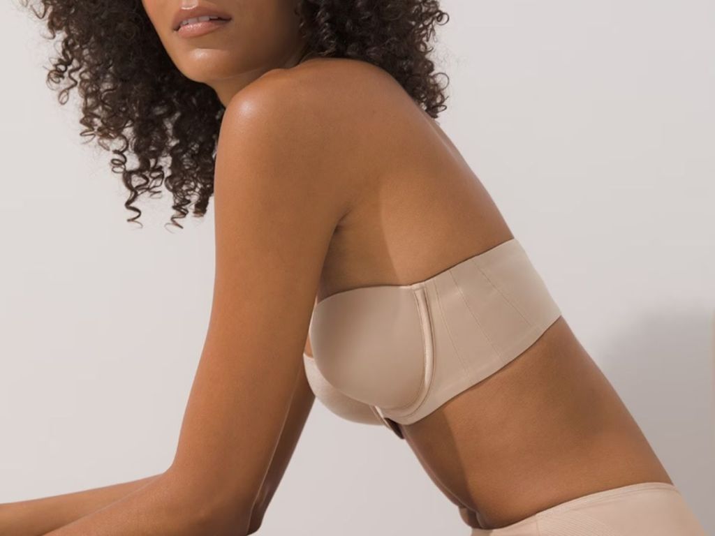 Side view of a woman wearing a Soma vandishing Back strapless bra