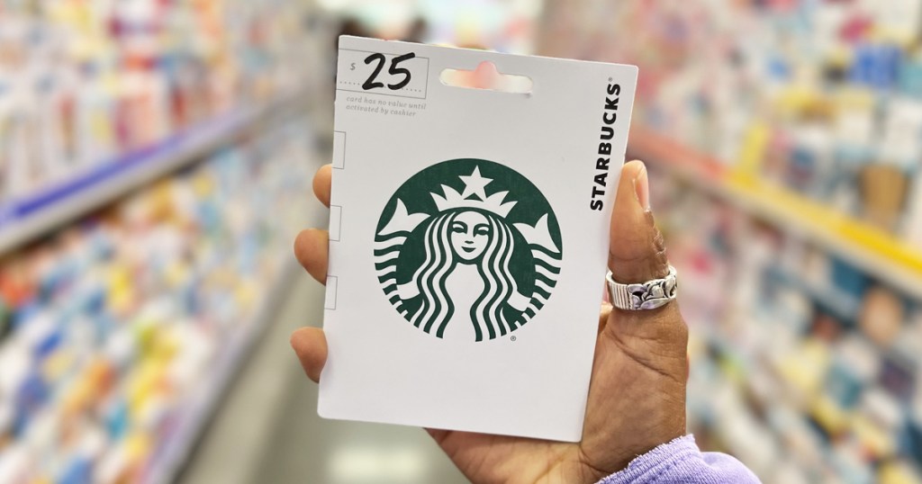hand holding up a $25 starbucks gift card
