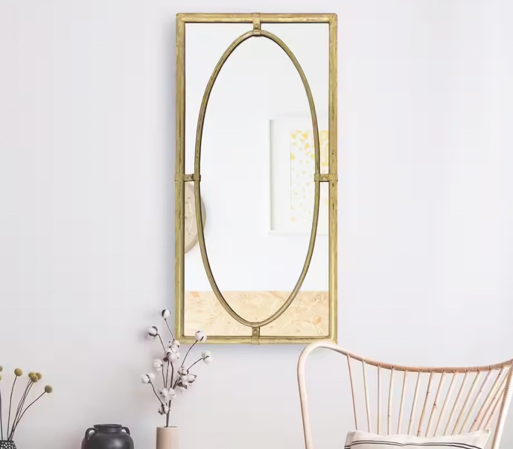 gold rectangle mirror on wall