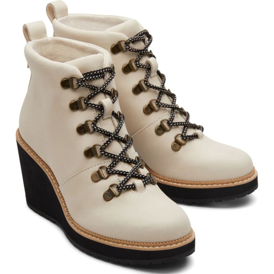 a sand-colored pair of lace-up wedge booties