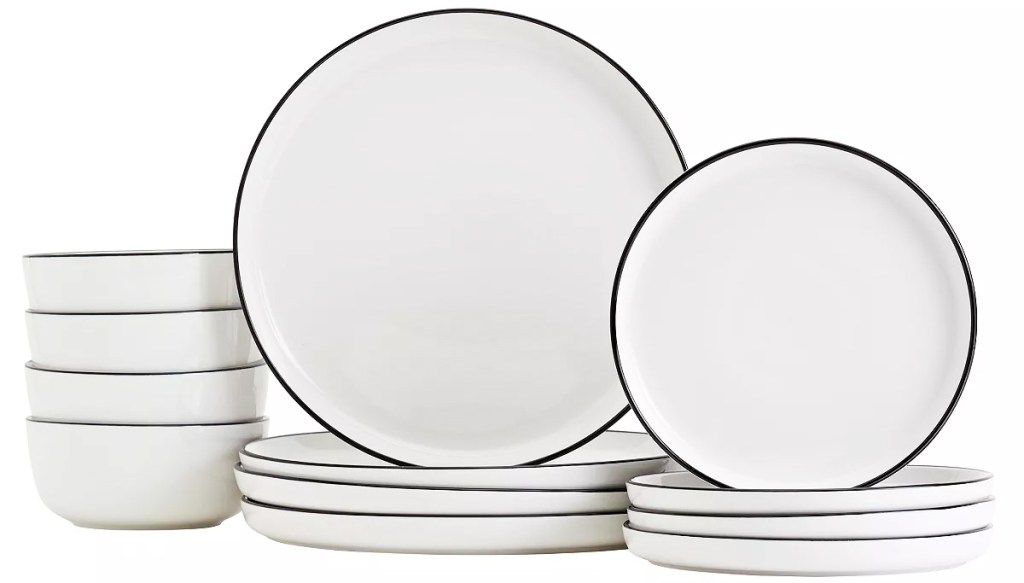 stacks of white dinner plates, salad plates, and bowls with black rims