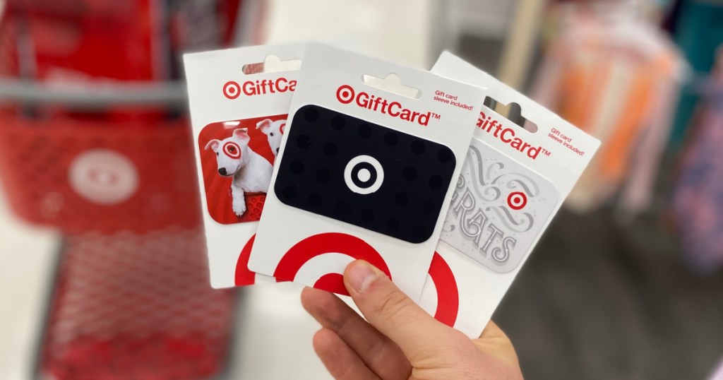 person holding 3 styles of Target Gift Cards