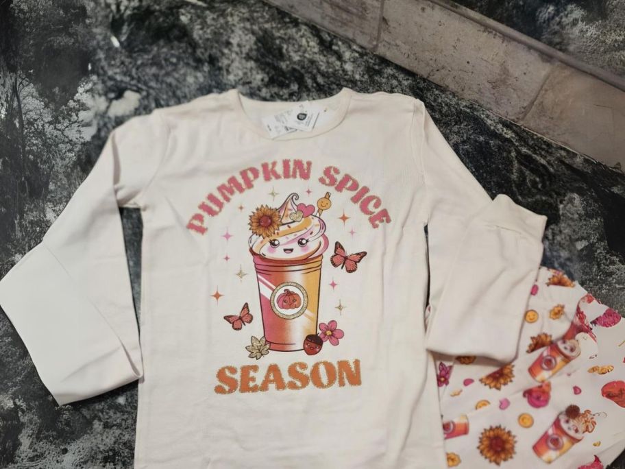 The Children's Place Baby & Kids Holiday Pajama Set - Pumpkin Spice Season on counter