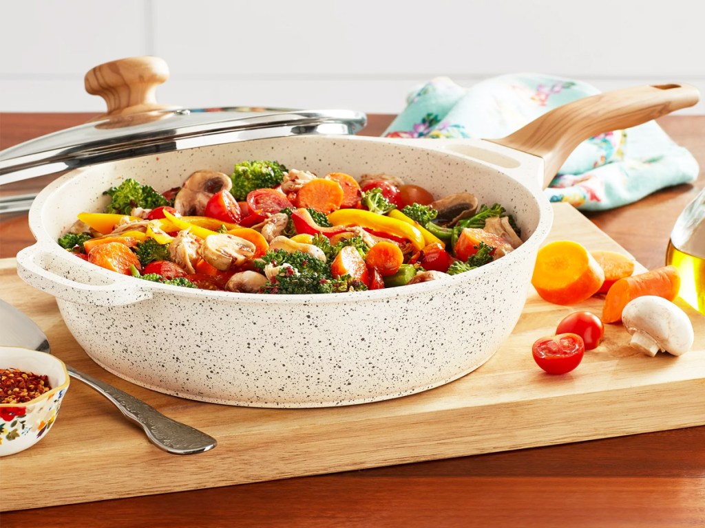 white speckled jumbo cooker pan with mixed vegetables inside