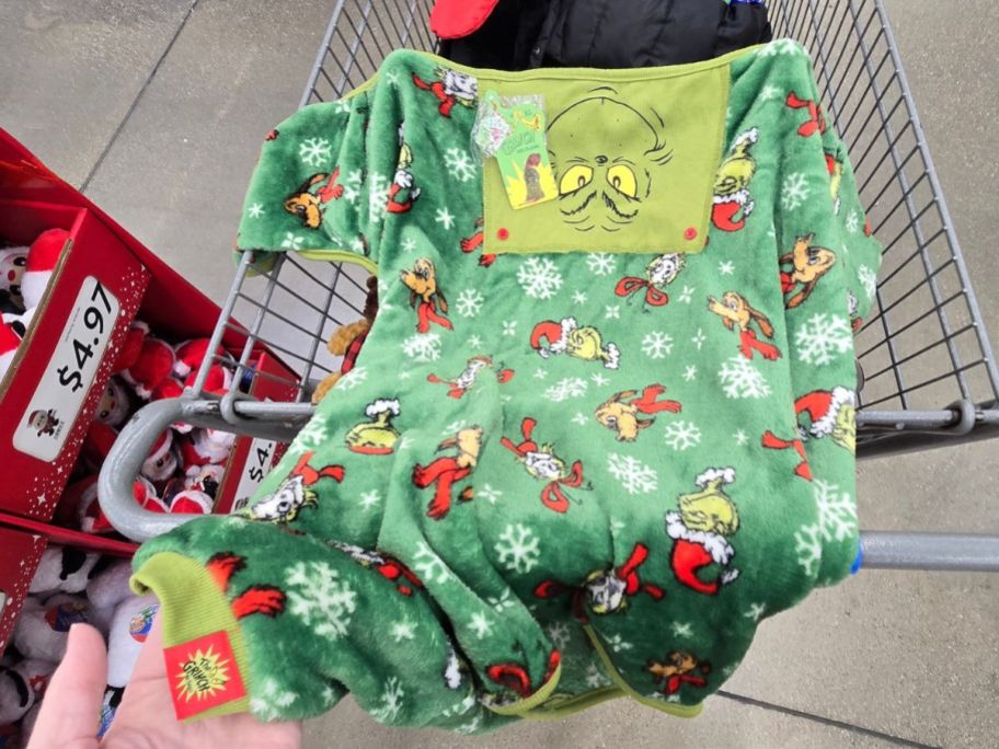 hand holding The grinch pajamas