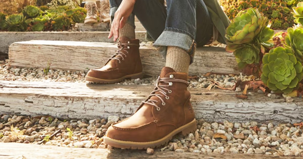 man wearing a brown pair of Timberland boots