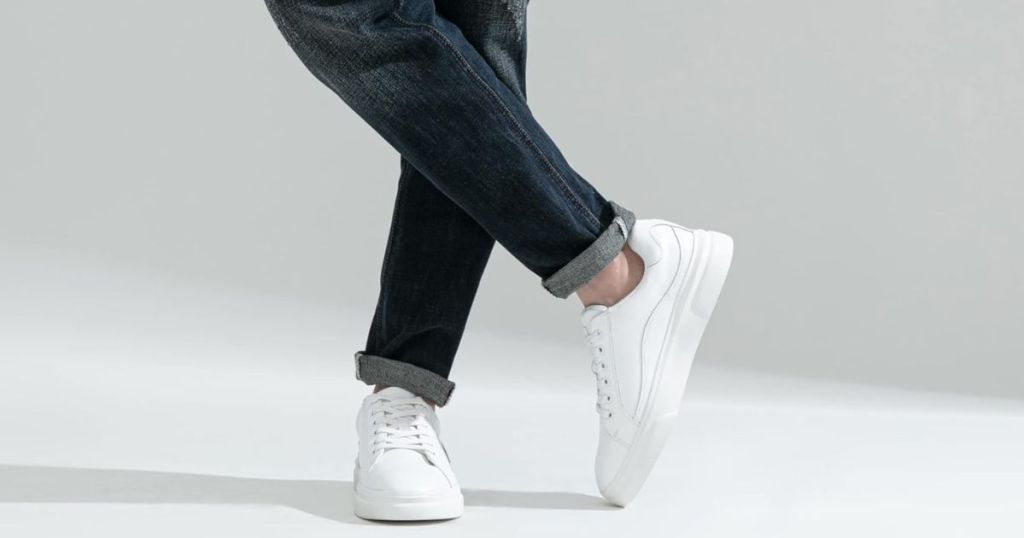 A man wearing Vostey Men's Fashion Sneakers white
