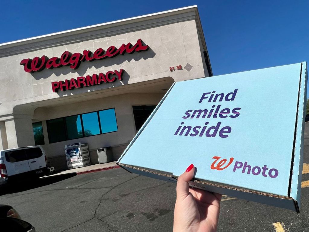 A Walgreens photo canvas in the box held up outside a Walgreens store