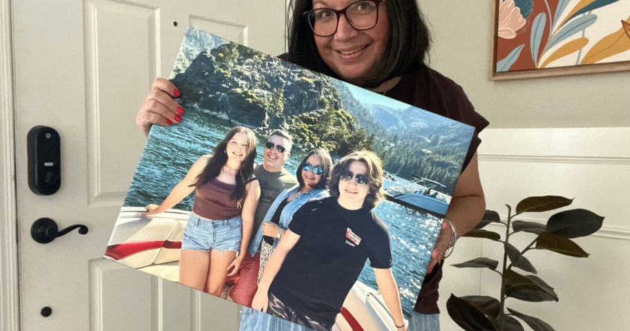 Woman holding a large Walgreens Photo Canvas