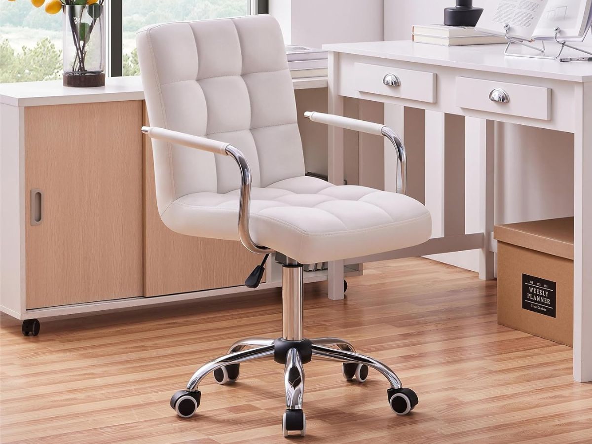 A Yaheetech white office chair near a desk