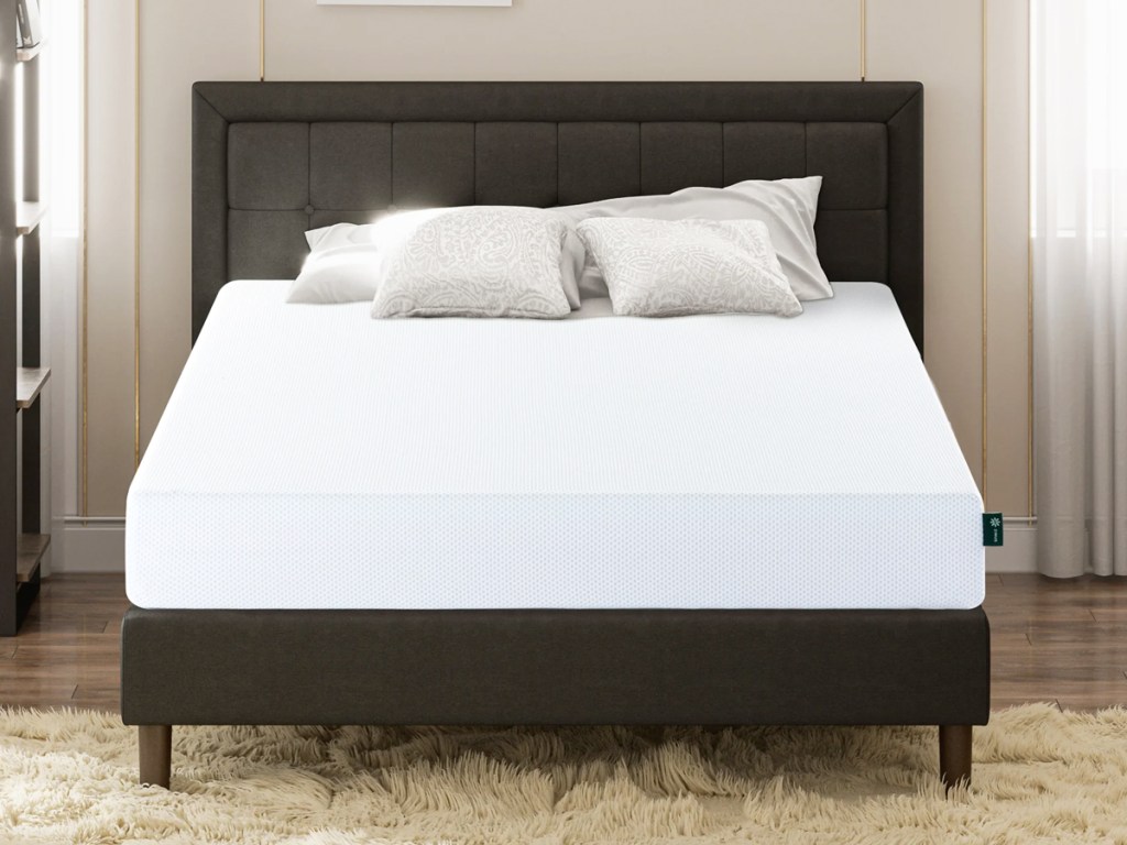 foam mattress on a black bed frame with matching headboard
