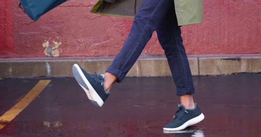 a models legs with feet wearing allbirds mizzles water repellent shoes 