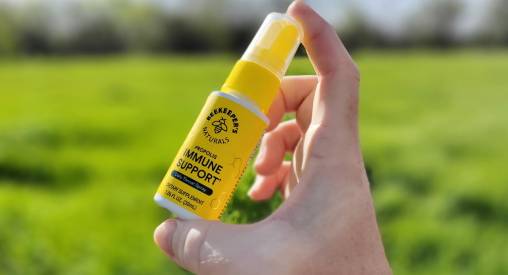 beekeepers immune support spray in woman's hand