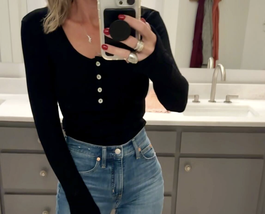 woman wearing black bodysuit with jeans