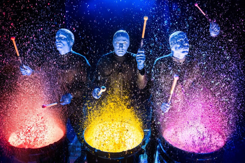 blue man group performing on stage