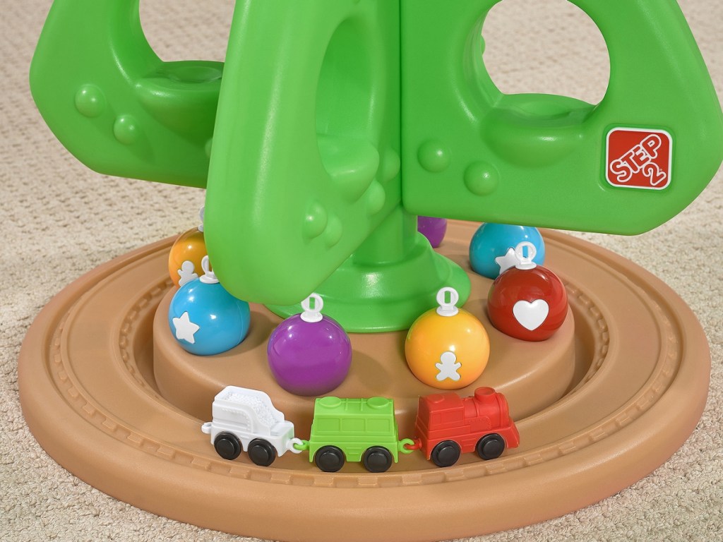 bottom of toddler Christmas tree with train and ornaments