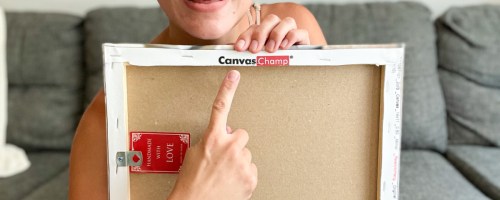 woman pointing to back of canvas