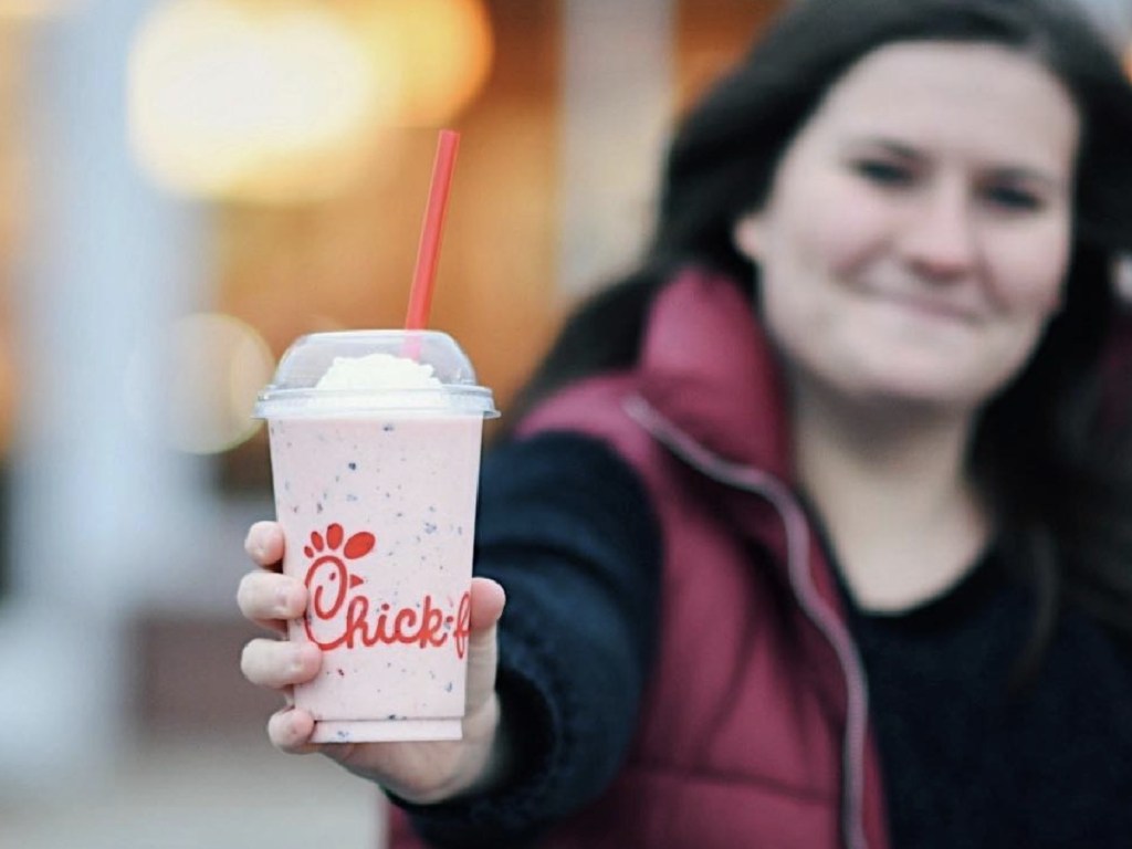 woman holding a chick-fil-a peppermint shake