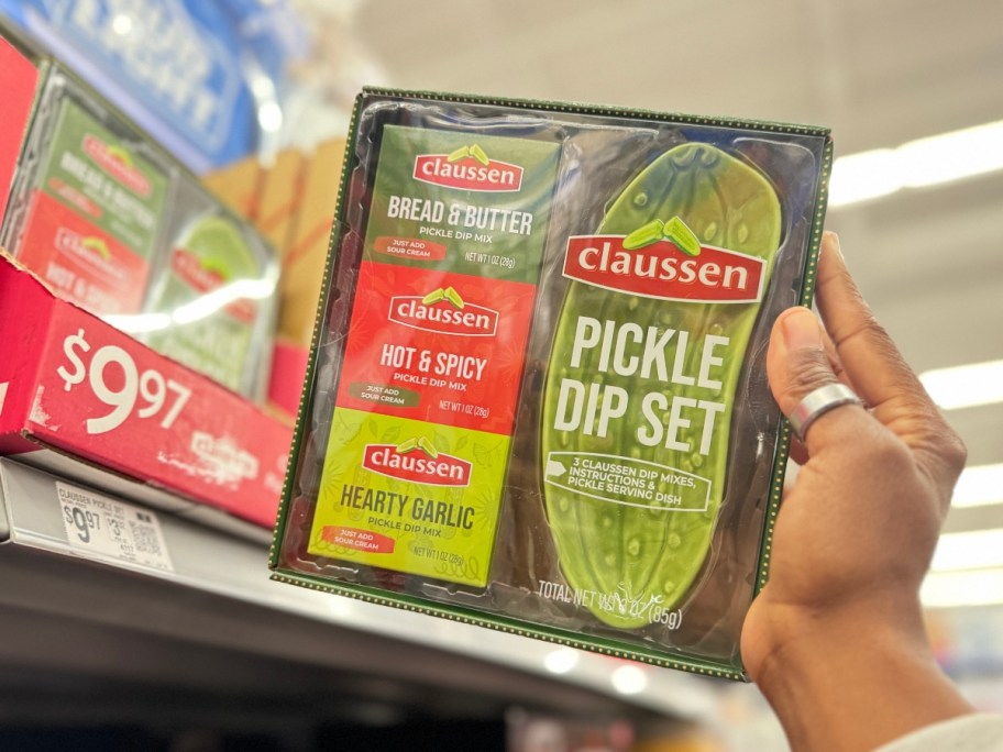 holding a boxed pickle gift set at Walmart