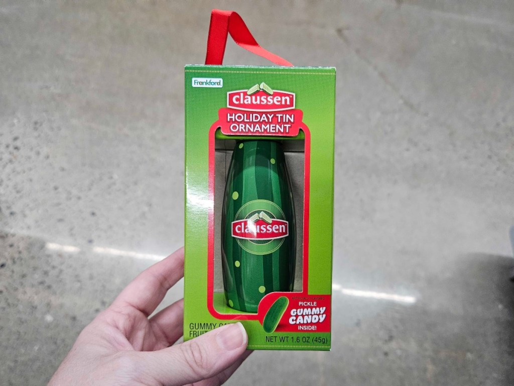holding a pickle ornament in a box