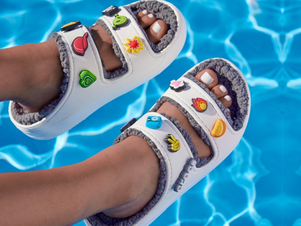 cozy croc sandals over water
